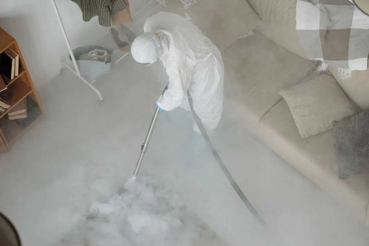 Biohazard cleanup technician in protective equipment, Cherry Creek, CO